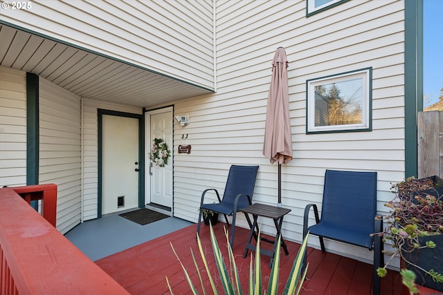 property entrance featuring a wooden deck