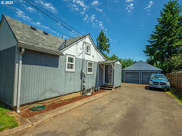 4930 SE 113th Ave, Portland, OR 97266 - view of front facade featuring an outbuilding and a garage