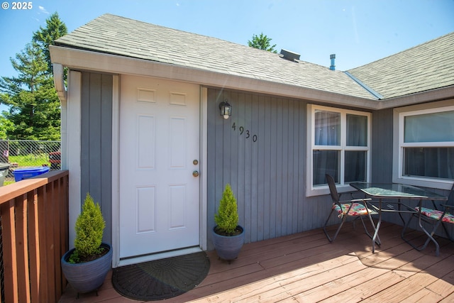 4930 SE 113th Ave, Portland, OR 97266 - entrance to property featuring roof with shingles, a wooden deck, and outdoor dining area