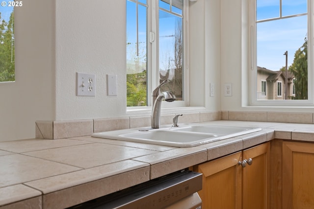 1874 NE 101st Ave Unit 202, Hillsboro, OR 97006 - kitchen with a sink, light countertops, a textured wall, and dishwasher