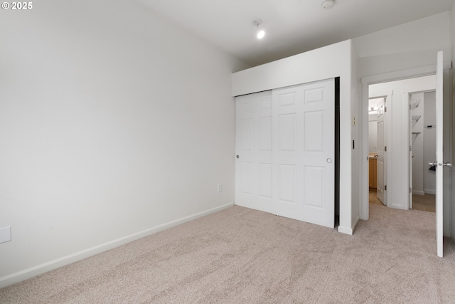 1874 NE 101st Ave Unit 202, Hillsboro, OR 97006 - unfurnished bedroom featuring carpet, baseboards, and a closet