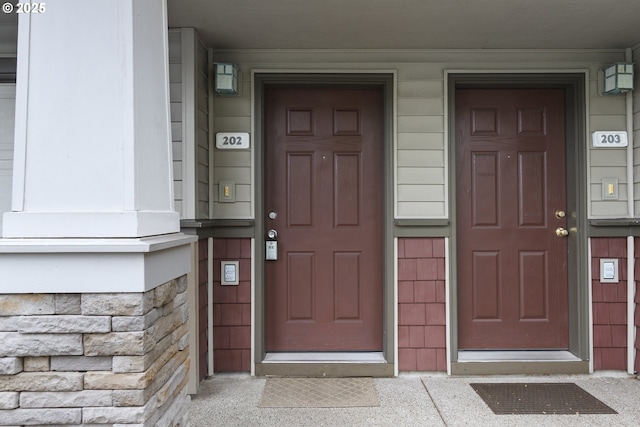 1874 NE 101st Ave Unit 202, Hillsboro, OR 97006 - property entrance featuring stone siding