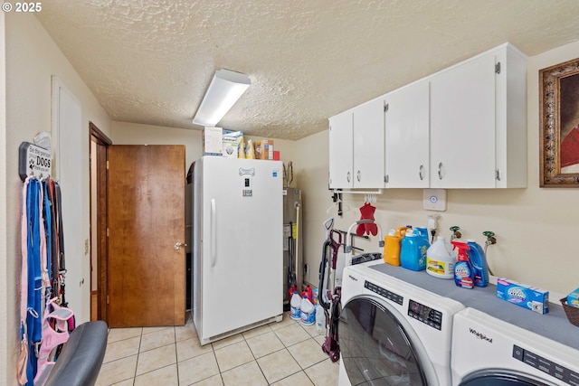 94020 E Shore Dr, North Bend, OR 97459 - washroom featuring washing machine and dryer, a textured ceiling, gas water heater, and light tile patterned floors