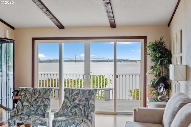 94020 E Shore Dr, North Bend, OR 97459 - sunroom with beam ceiling, a water view, and plenty of natural light