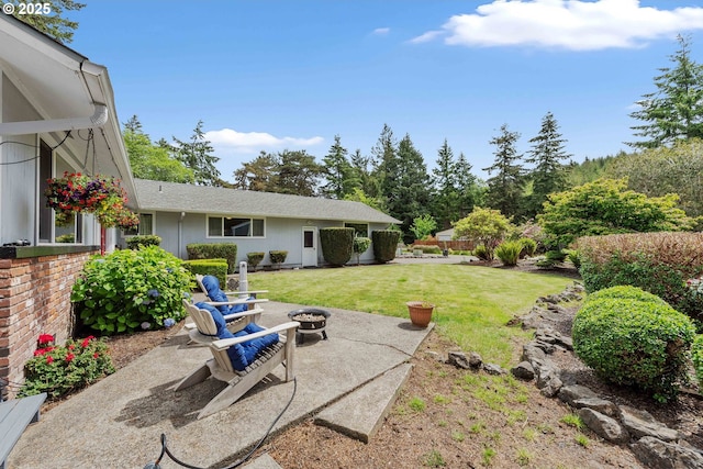 94020 E Shore Dr, North Bend, OR 97459 - view of grassy yard with a patio area and a fire pit