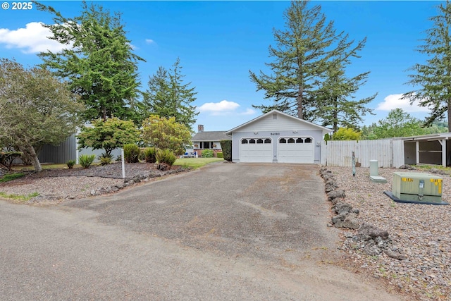 94020 E Shore Dr, North Bend, OR 97459 - view of front of property with a garage and asphalt driveway