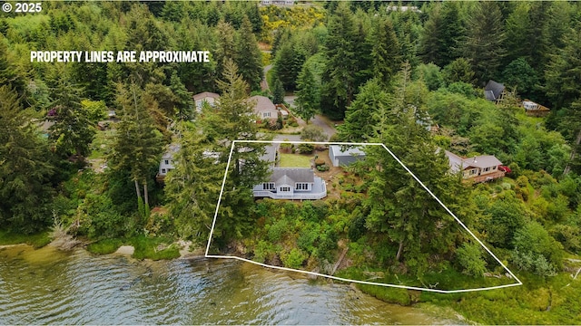 94020 E Shore Dr, North Bend, OR 97459 - aerial overview of property's location with property parcel outlined, a nearby body of water, and a heavily wooded area