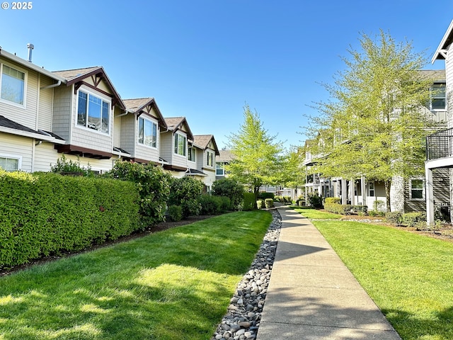 836 NW 118th Ave Unit 104, Portland, OR 97229 - surrounding community featuring a residential view and a lawn