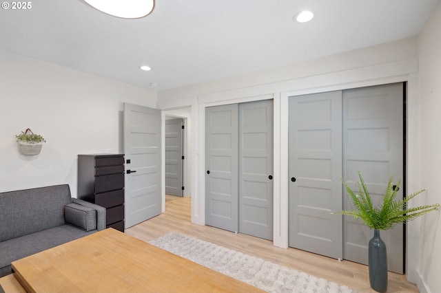 office space featuring light wood-type flooring and recessed lighting