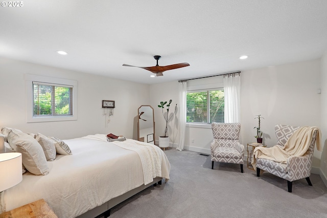 carpeted bedroom with ceiling fan, baseboards, and recessed lighting