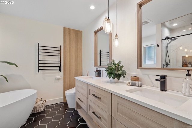 full bathroom with toilet, a sink, a shower stall, radiator, and double vanity