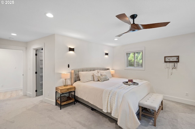 carpeted bedroom featuring ceiling fan, baseboards, and recessed lighting