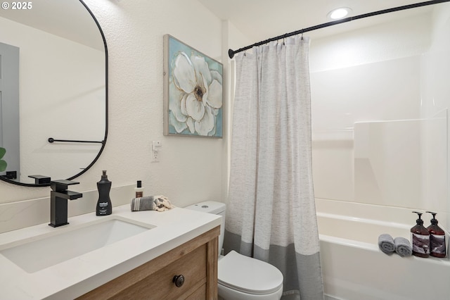 bathroom featuring toilet, shower / bathtub combination with curtain, and vanity