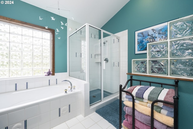 105 NW 45th St Unit 4, Newport, OR 97365 - bathroom with a bath, a shower stall, vaulted ceiling, and tile patterned floors