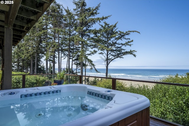 105 NW 45th St Unit 4, Newport, OR 97365 - view of swimming pool featuring a water view, a view of the beach, and a hot tub