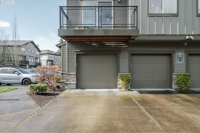 garage featuring concrete driveway