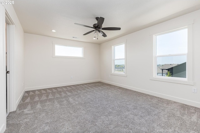carpeted empty room with baseboards, a ceiling fan, and recessed lighting