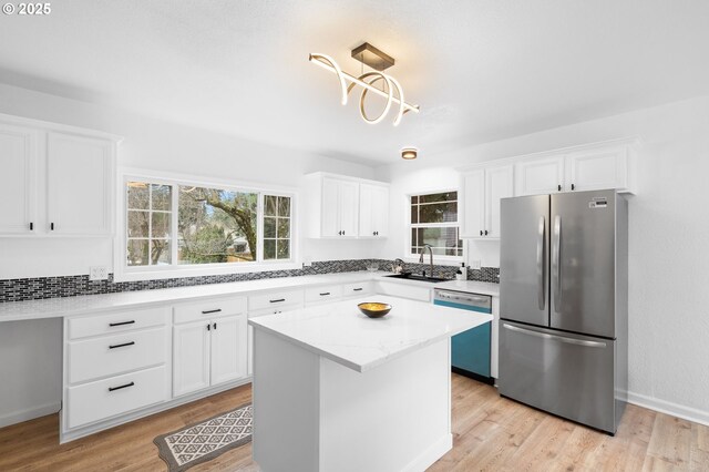 13332 SE Harold St, Portland, OR 97236 - kitchen featuring freestanding refrigerator, dishwasher, a sink, and plenty of natural light