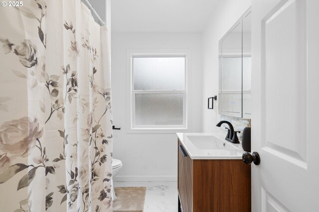13332 SE Harold St, Portland, OR 97236 - bathroom with marble look tiles, toilet, vanity, baseboards, and curtained shower
