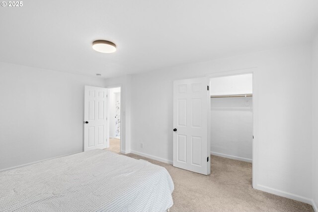 13332 SE Harold St, Portland, OR 97236 - bedroom with light carpet, a spacious closet, baseboards, and a closet