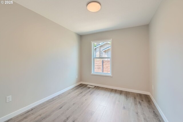 4106 SE 122nd Ave, Portland, OR 97236 - unfurnished room featuring light wood-type flooring and baseboards