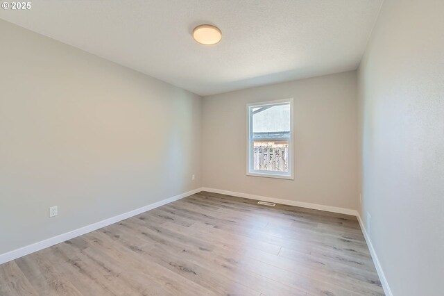 4106 SE 122nd Ave, Portland, OR 97236 - unfurnished room featuring light wood finished floors and baseboards