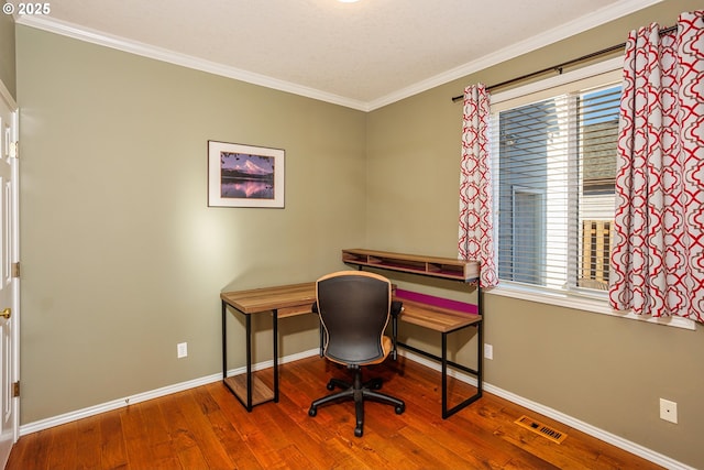 office space featuring wood-type flooring and ornamental molding