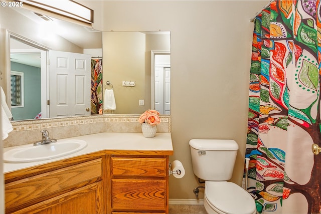 bathroom featuring vanity and toilet