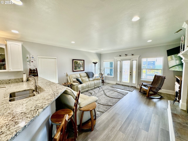 842 Chetco Point Ter, Brookings, OR 97415 - living room featuring ornamental molding, wood finished floors, and recessed lighting