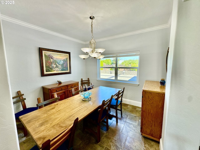 842 Chetco Point Ter, Brookings, OR 97415 - dining space with a chandelier, dark stone finish floors, and crown molding