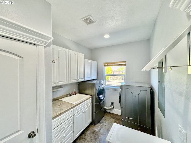 842 Chetco Point Ter, Brookings, OR 97415 - laundry area with washer / clothes dryer and cabinet space