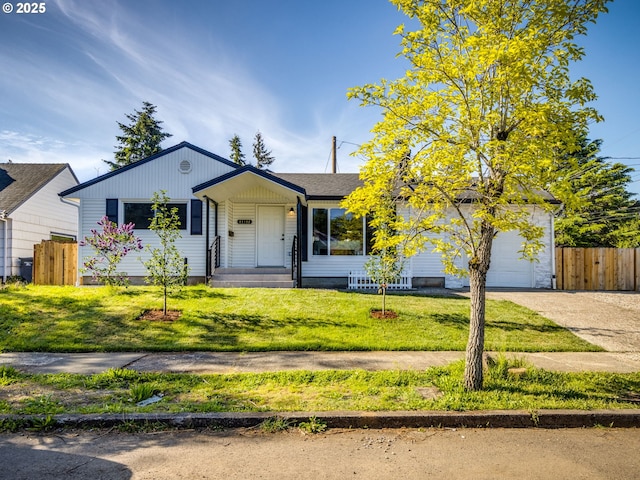 single story home with concrete driveway and a garage