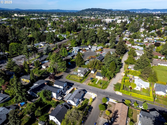 view of property location featuring nearby suburban area and a mountainous background