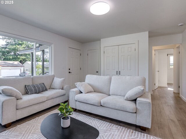 living room with light wood-style floors and baseboards