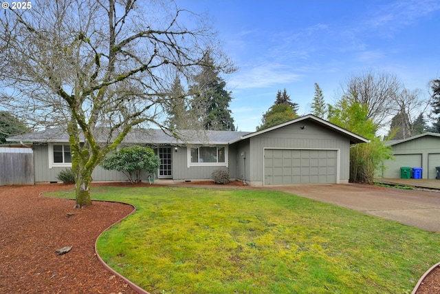 ranch-style home with a garage and a front lawn