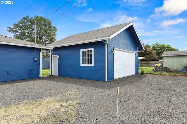 detached garage with fence