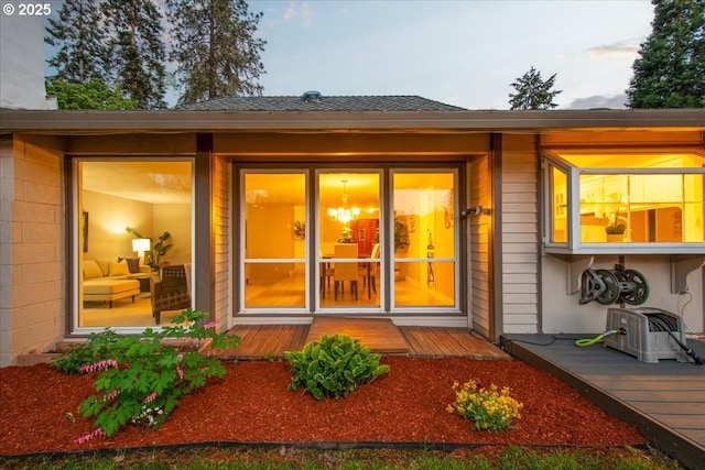 doorway to property with a deck