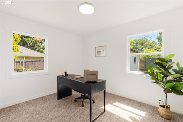 office space featuring carpet floors and baseboards