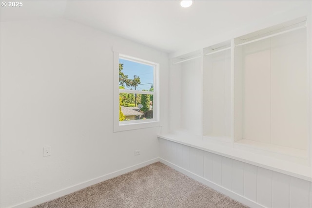 interior space with carpet floors and baseboards