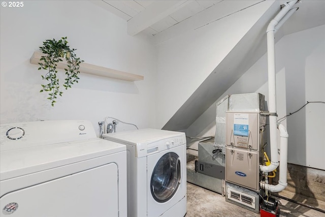 washroom featuring laundry area and washing machine and dryer