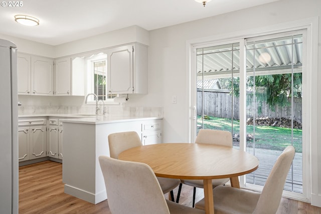 dining space with light wood-type flooring