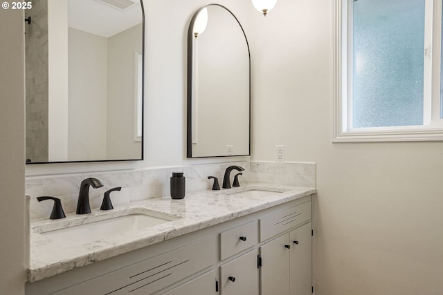 full bath featuring a sink and double vanity