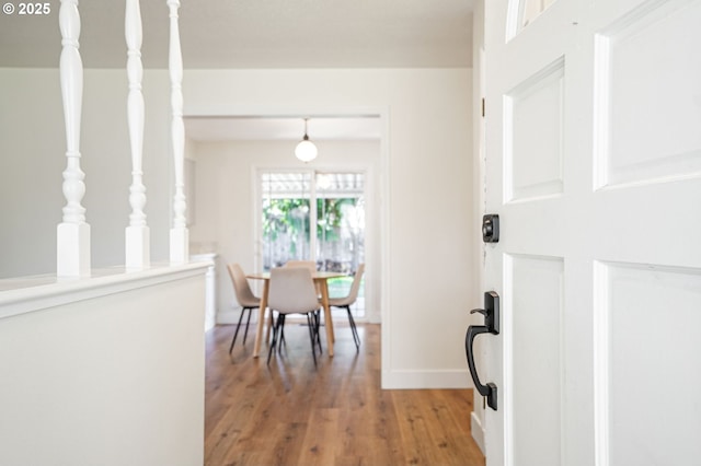 entryway featuring light wood-type flooring and baseboards