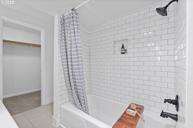 bathroom with tile patterned flooring and shower / bath combo with shower curtain