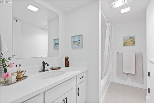 bathroom with tile patterned floors, vanity, and shower / tub combo