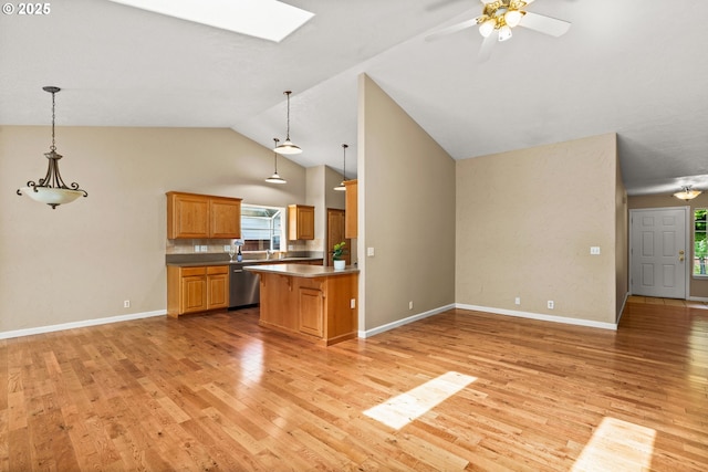 3473 Parker Ln, Springfield, OR 97477 - kitchen with dishwasher, open floor plan, light wood-style flooring, healthy amount of natural light, and vaulted ceiling