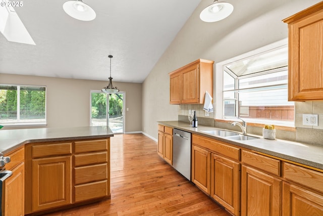 3473 Parker Ln, Springfield, OR 97477 - kitchen with dishwasher, a sink, light wood-style flooring, lofted ceiling, and hanging light fixtures