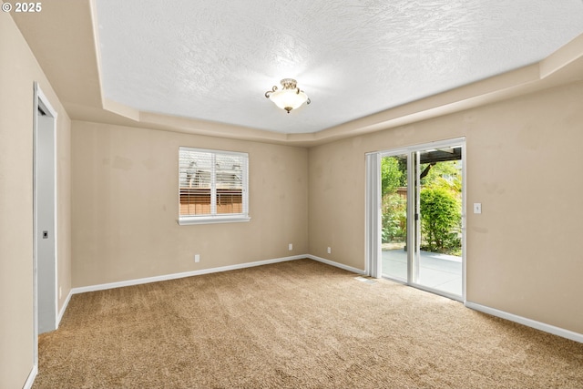 3473 Parker Ln, Springfield, OR 97477 - spare room featuring a textured ceiling, healthy amount of natural light, carpet floors, and baseboards
