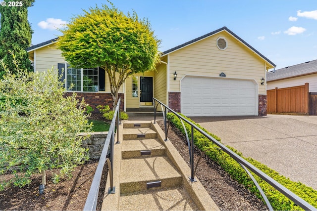 3473 Parker Ln, Springfield, OR 97477 - view of front facade featuring brick siding, concrete driveway, and an attached garage