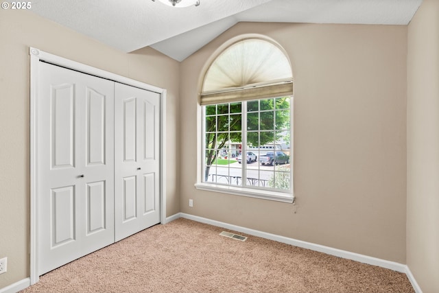 3473 Parker Ln, Springfield, OR 97477 - unfurnished bedroom with carpet flooring, a closet, baseboards, and lofted ceiling